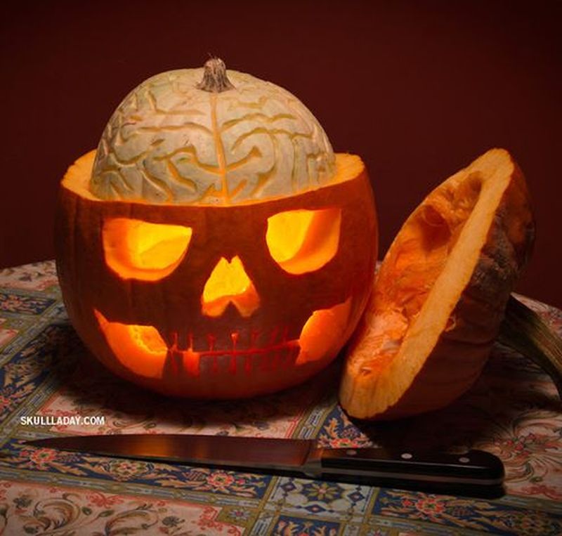 carved Pumpkin Skull with an Exposed Squash Brain for halloween 
