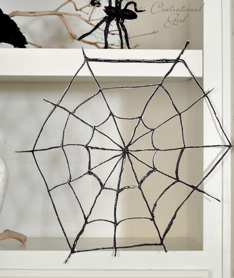 DIY hot glue spider web on shelf 
