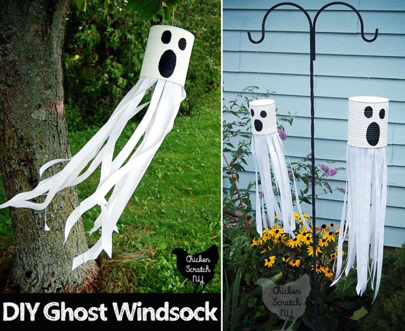 DIY Tin Can Ghosts hanging from tree 