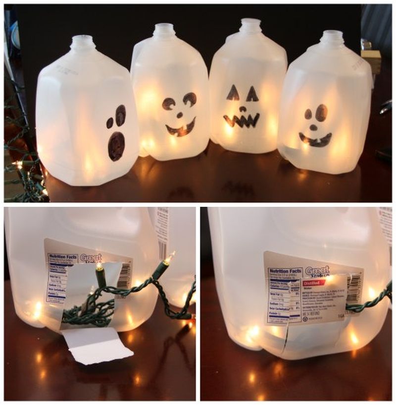 milk jug lantern with spooky faces 