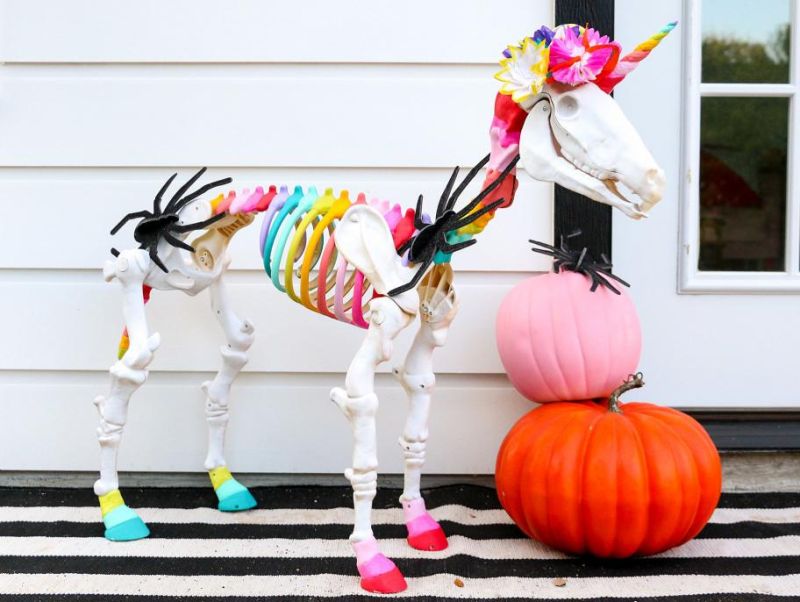 Rainbow Skeleton Unicorn Grazing in Yard - Outdoor skeleton decoration ideas 