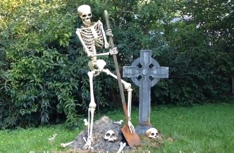 Skeleton digging a grave