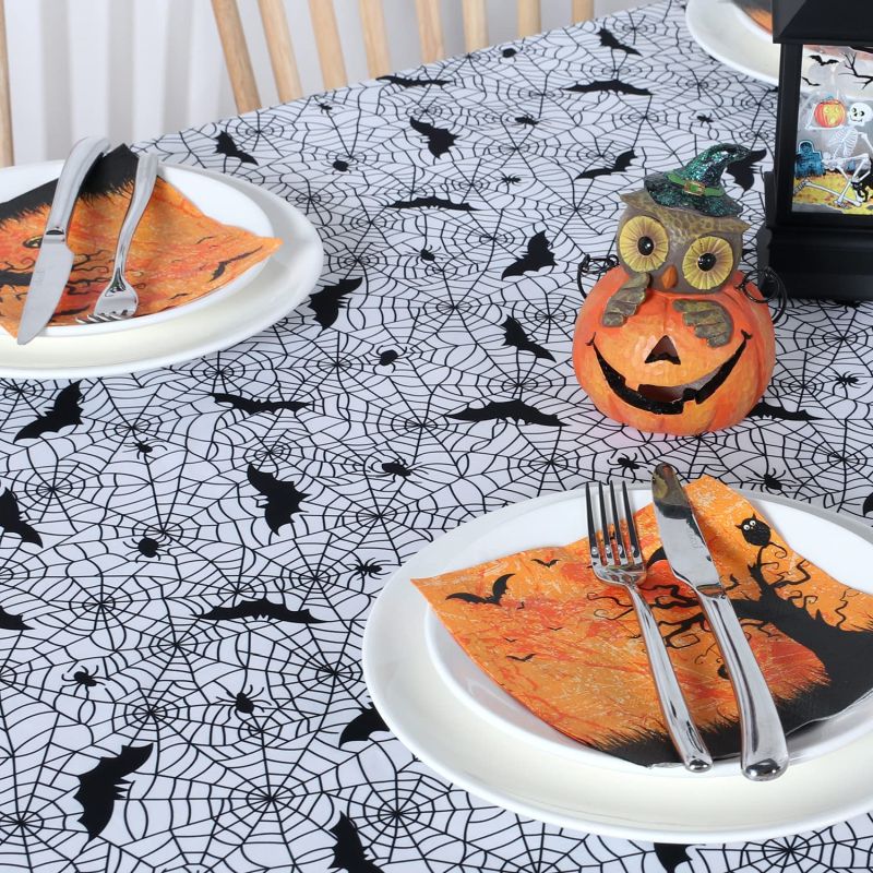 White oblong tablecloth with bats printed on it