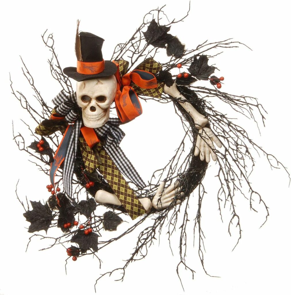 Halloween wreath featuring skull and skeleton arms, artificial berry clusters and assorted leaves.